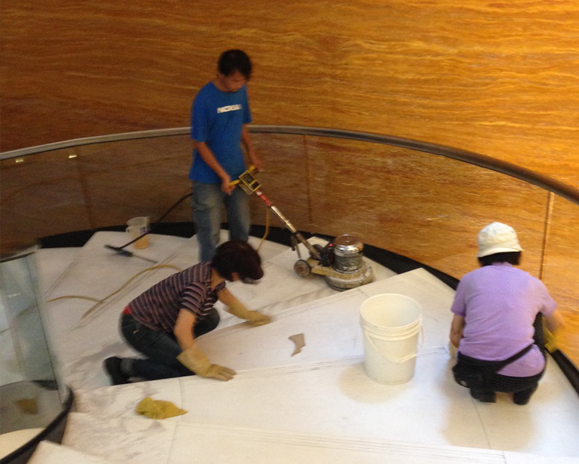 workers-cleaning-waxing-marble-stairs